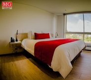 Bedroom 2 MG Hotels & Suites