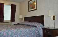 Bedroom 7 Passport Inn Suites