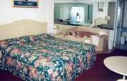 Phòng ngủ 2 Passport Inn Suites