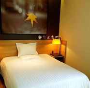 Kamar Tidur 4 Iu Hotel Chengdu New International Conference And