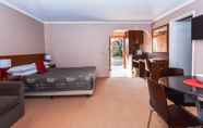 Kamar Tidur 3 River Country Inn - Adults Only