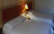 Kamar Tidur 4 7 Days Inn Turpan Da Shi Zi Hotel