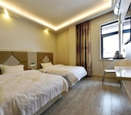 Bilik Tidur 4 Shell Hotel Shanghai Baoshan Hutai Road Branch