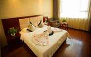 Bedroom 4 Greentree Inn Jiuquan Guazhou Zhangzhi Park Expres