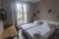 ห้องนอน Logis Hotel Le Relais Guillaume De Normandy