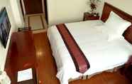 Bedroom 2 GreenTree Inn Wuxi Binhu District Taihu Pearl Deve