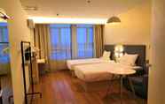Bedroom 5 Hanting Hotel (Qingdao Develop. Zone Dongjiakou Po