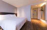 Kamar Tidur 4 Hanting Express Xinchang Dafosi Hotel