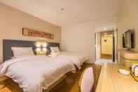 Kamar Tidur Hanting Hotel (Emeishan Store)