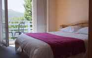 Bedroom 2 Logis Hotel le Castel Fleuri