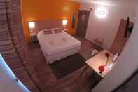 ห้องนอน Logis Hotel le Cadet de Gascogne