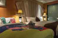 Bedroom Jinlong Holiday Hotel