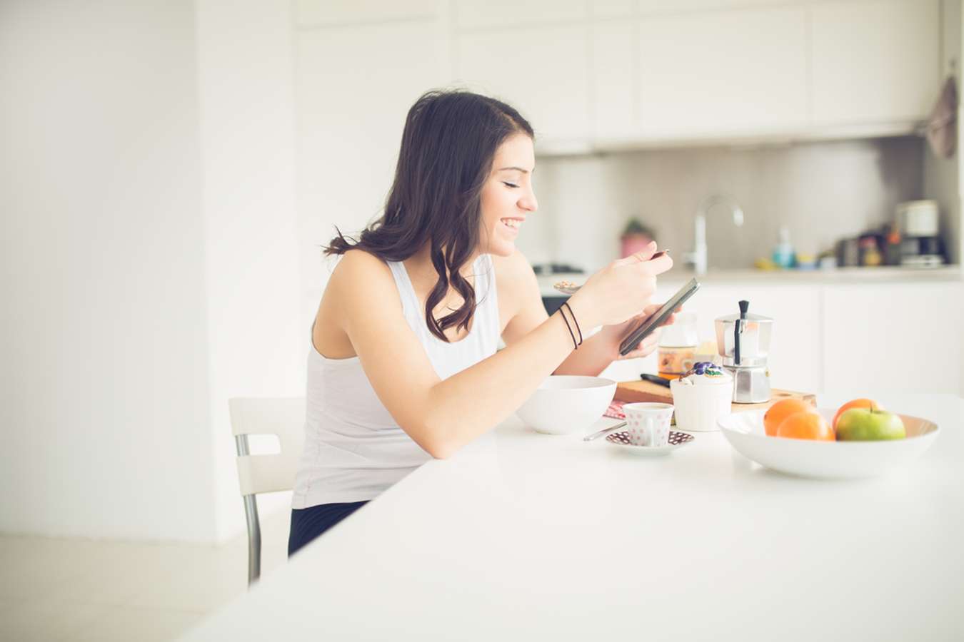 a young woman eating at home