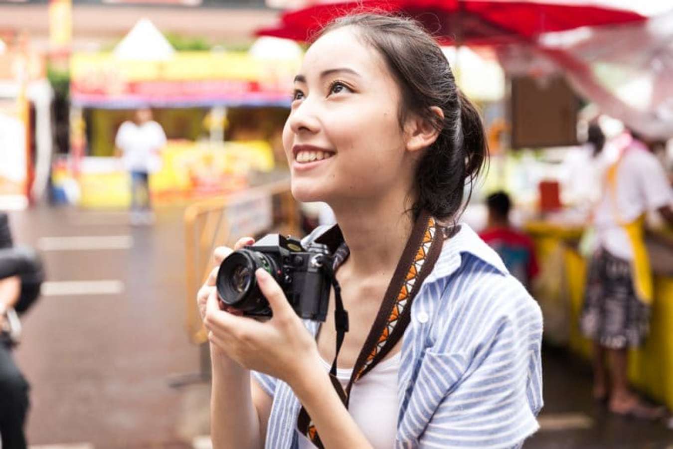 Girl holding camera 