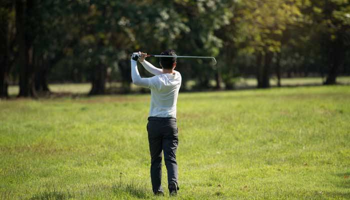 Man playing golf