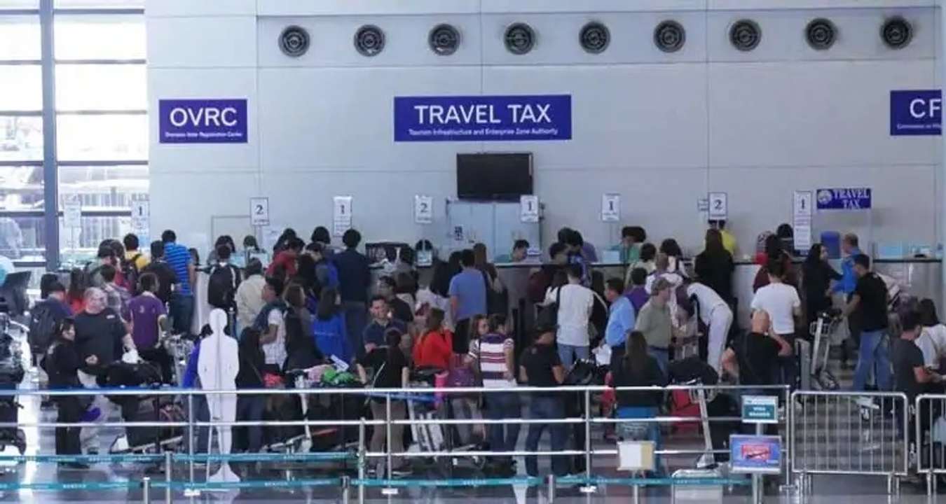 who pays travel tax in philippines