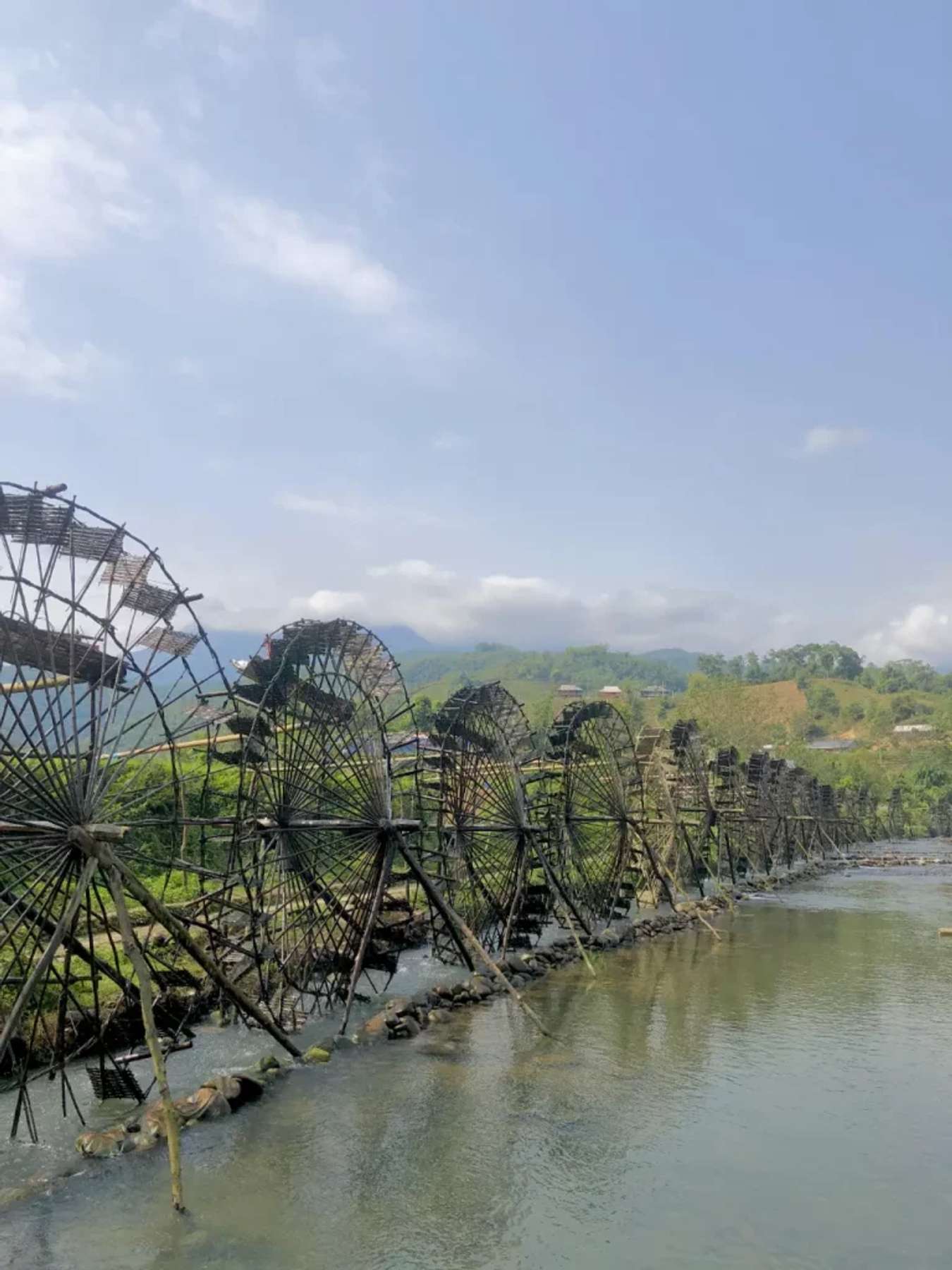 Na Khuong water wheel seen from the wooden bridge.