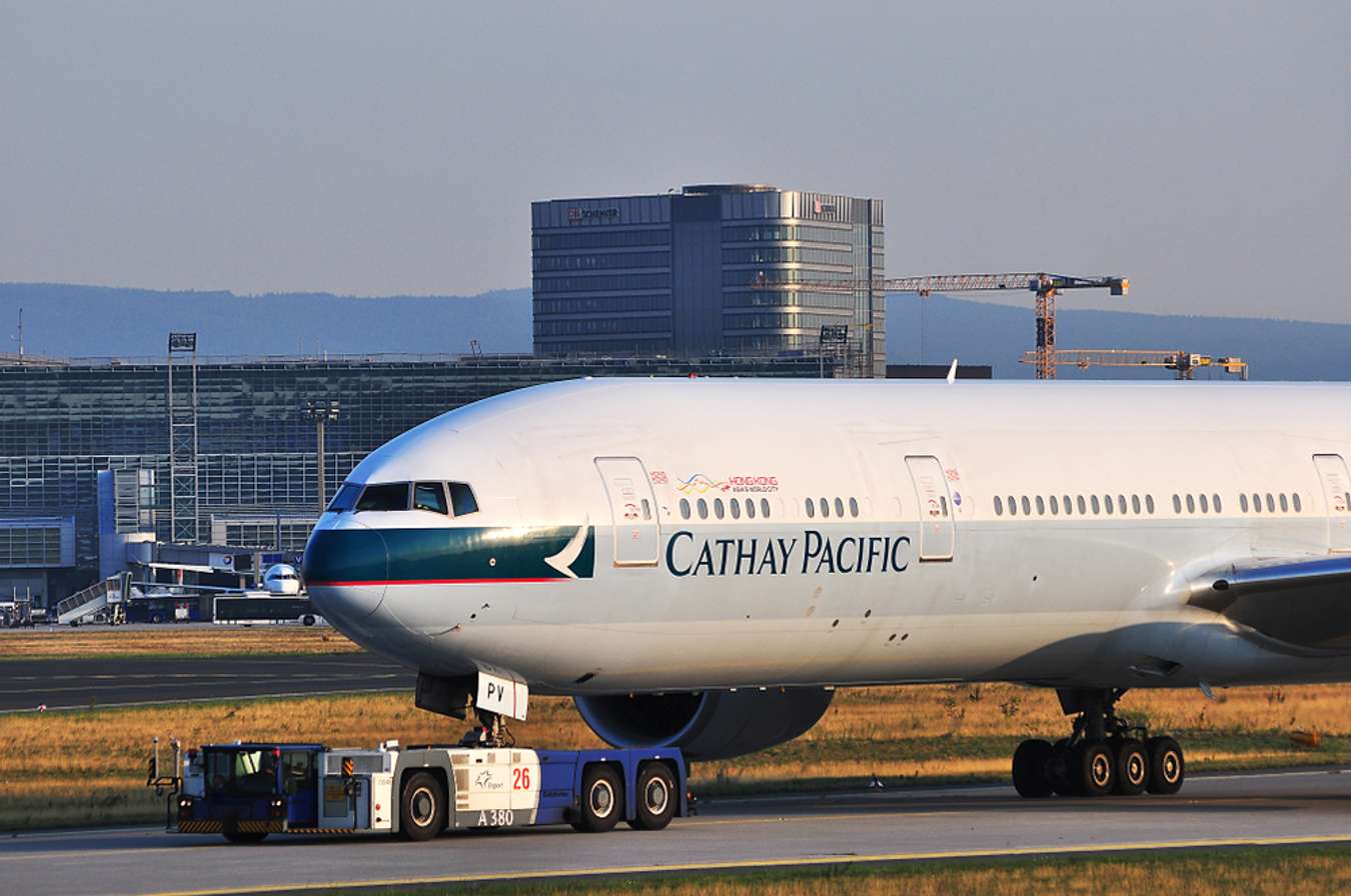 cathay pacific add travel insurance