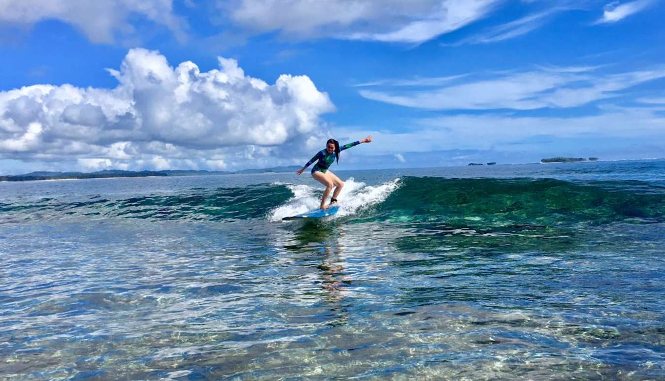 people are waiting for the right time to surf in the Philippines