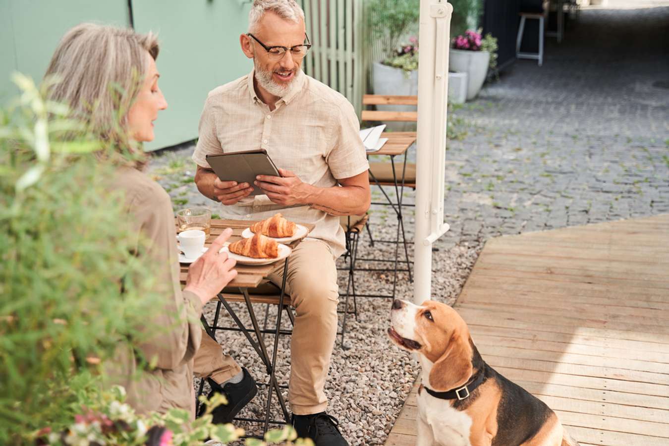 Woman enjoy with her dog in Wooftopia Pet Café