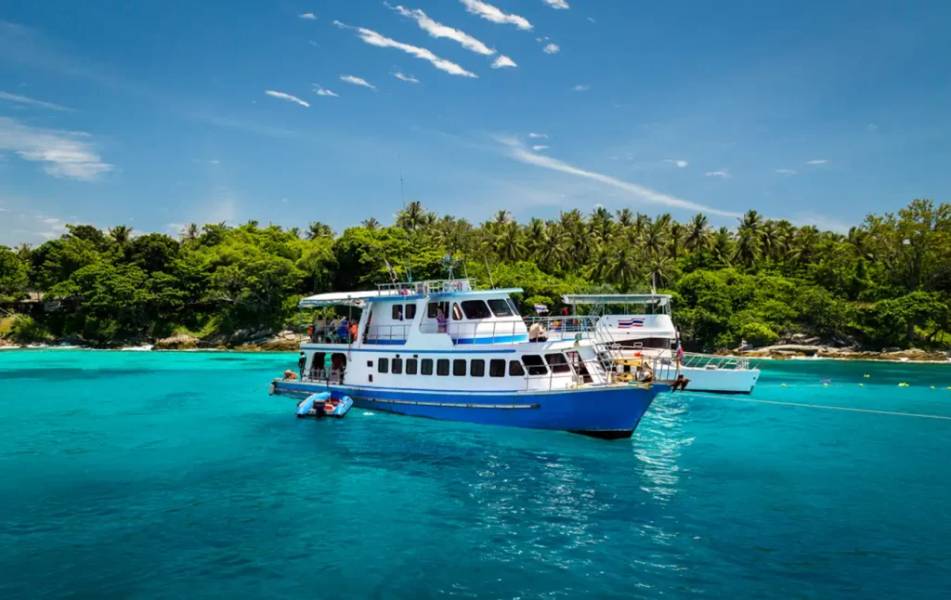 A boat floating in the water at the Racha Islands