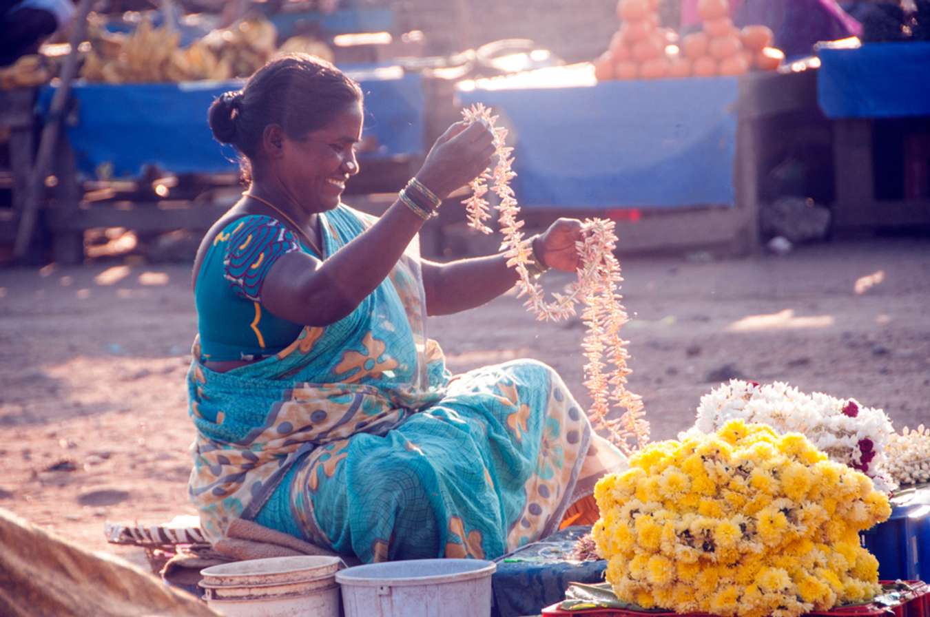 Unidentified woman flower vendor selling flowers in the flower market, The Chennai flower market is known as largest flower market