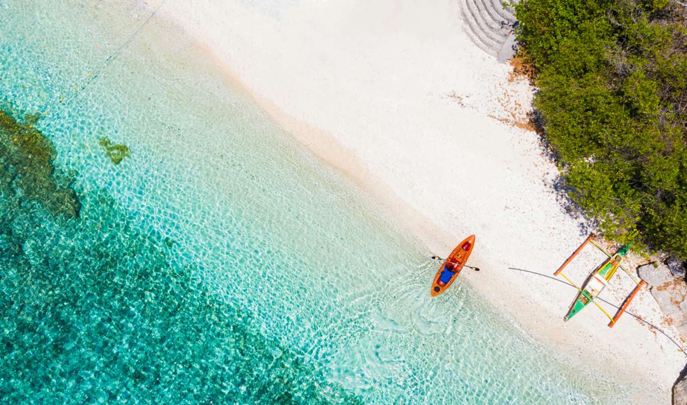 Top view of white sand beach and seashore at Sumilon island beach Oslob, Cebu, Philippines