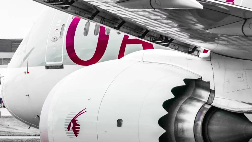 A Qatar Airways plane at an airport.