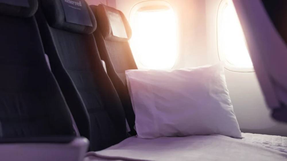 An Economy Skycouch on and Air New Zealand flight.