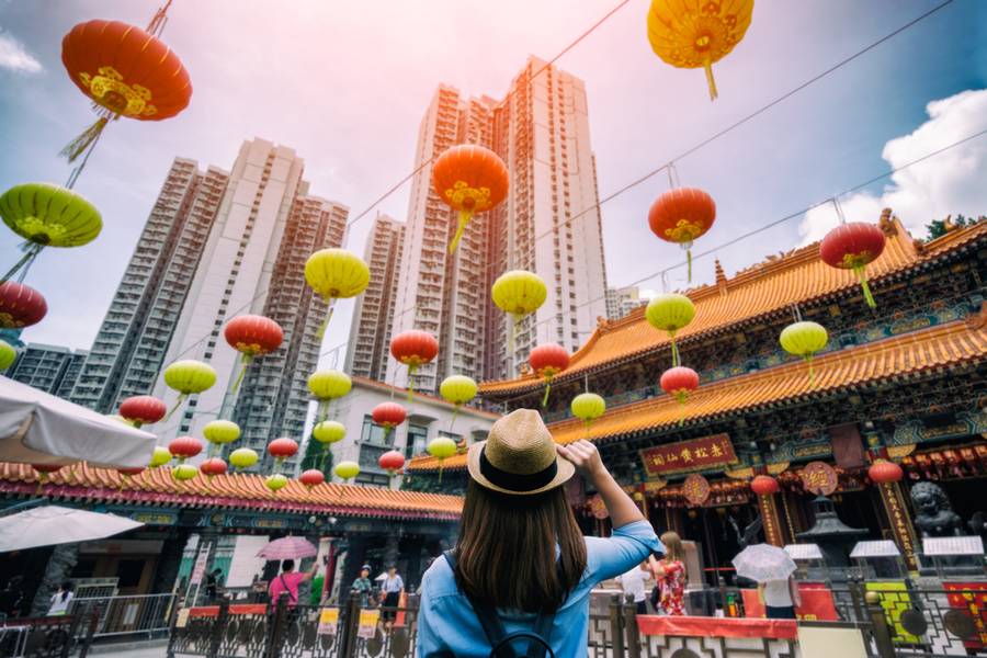 Young woman traveler is visiting at Wong Tai Sin temple in Hong Kong