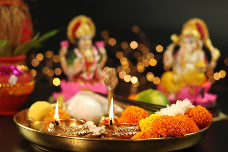 Golden Brass Diya Deep Dia Lamp Lit in Pooja Thali With Flowers. 