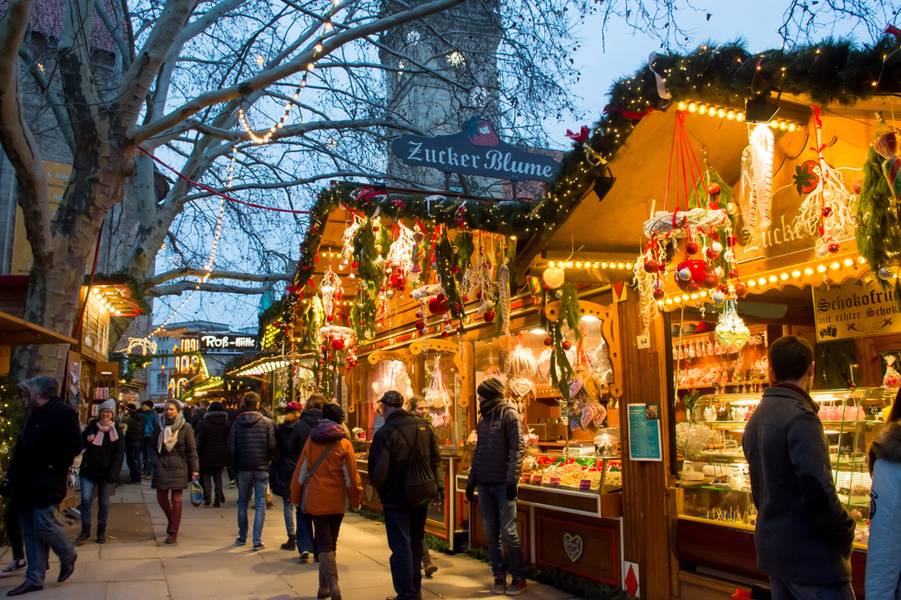 People are come to Christmas market or Weihnachtsmarkt for shopping and celebrate