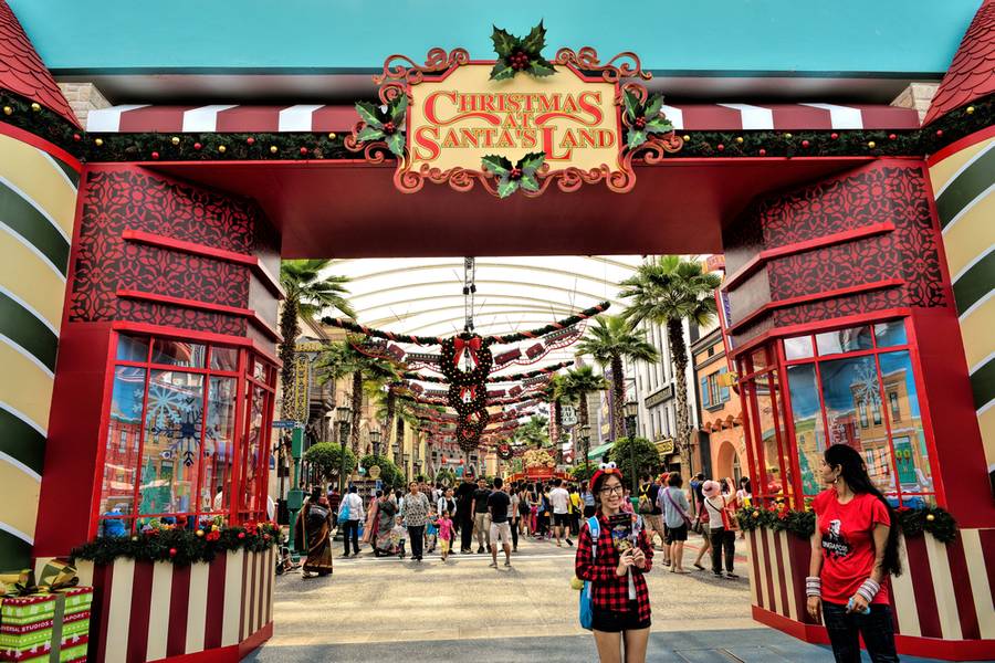SINGAPORE - DECEMBER 13: Tourists taking pictures in front of Christmas SantaÃ¢Â?Â?s Land in Universal Studios on December 13, 2014 at Singapore Resorts World Sentosa. 