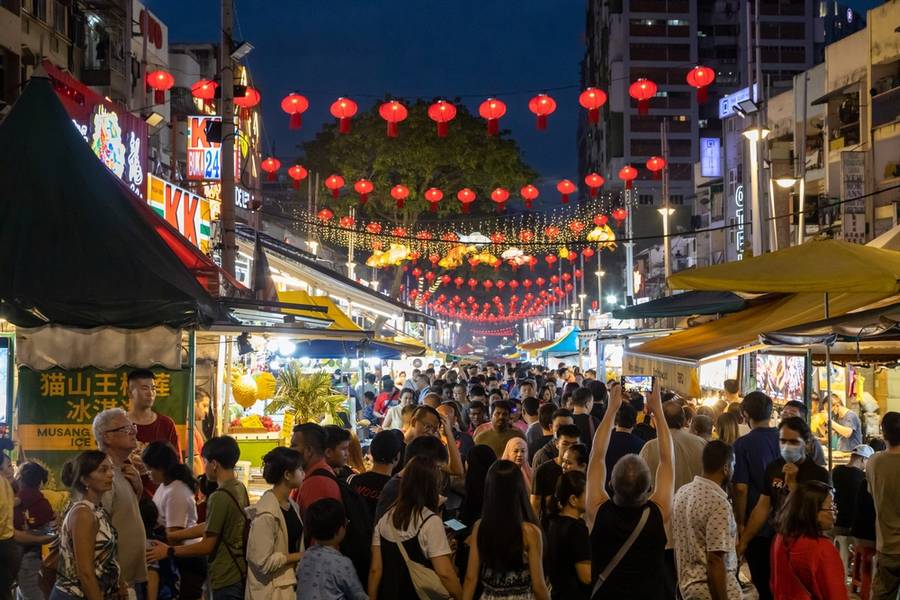Kuala Lumpur, Malaysia - February 9, 2024: A crowded street scene of Jalan Alor a street food night market located in the Bukit Bintang area of Kuala Lumpur, Malaysia. 