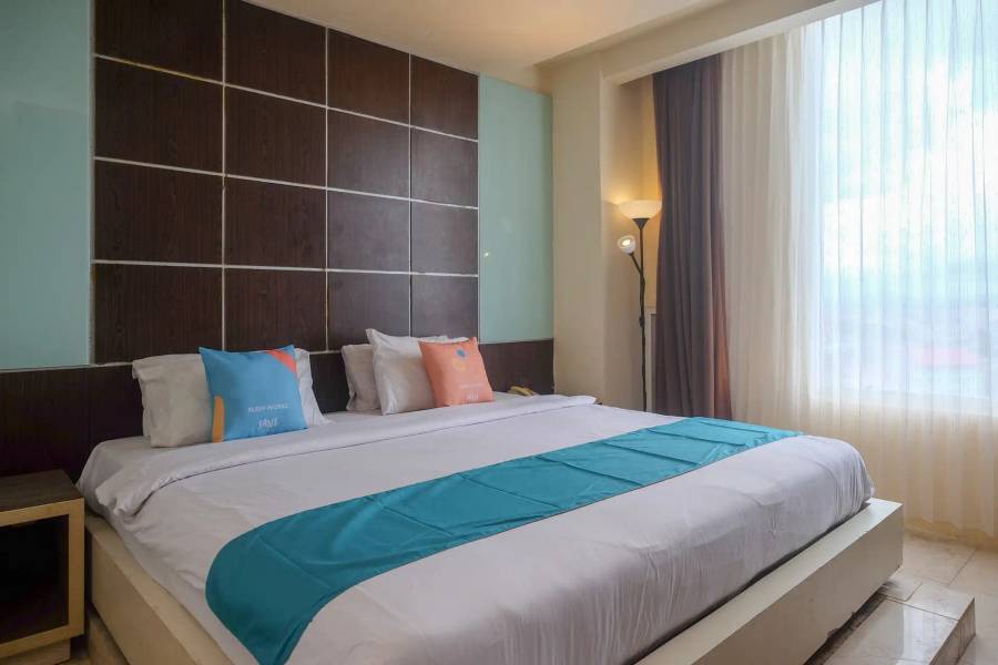 Sans Hotel Lynt Makassar - Bedroom