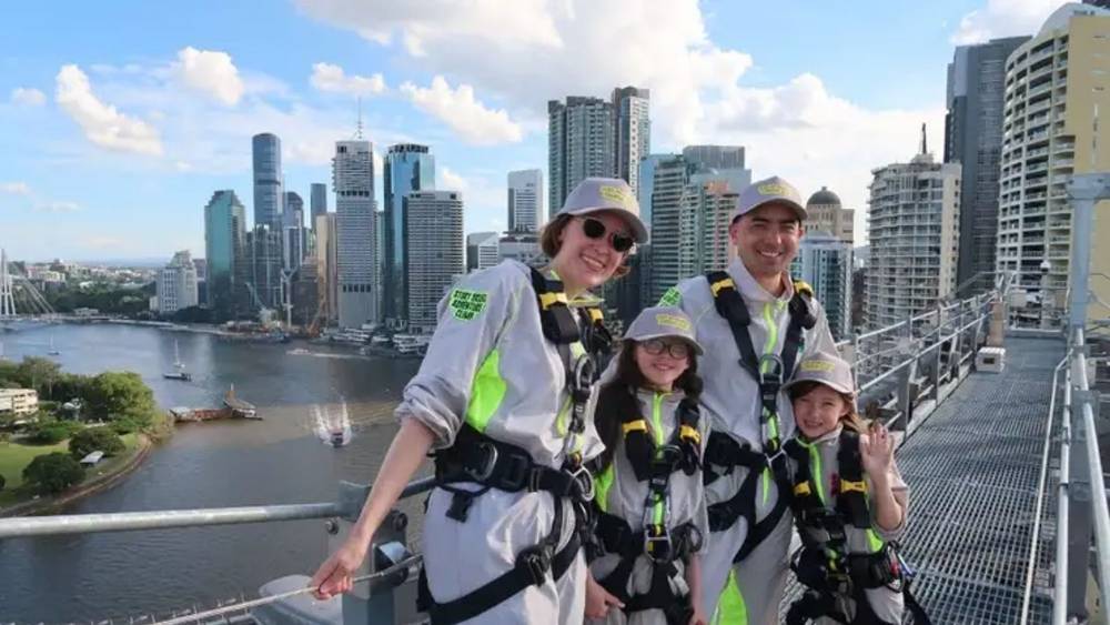 A family with children doing the Brisbane Story Bridge Climb