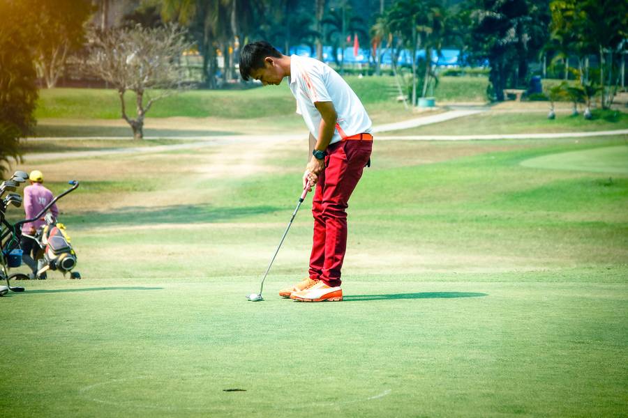 Man playing golf on field