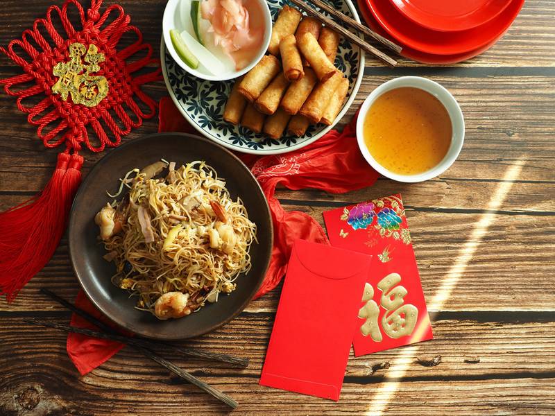 Chinese Lunar New Year lucky food longevity noodles and spring rolls