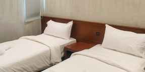 Deluxe Twin Travel Biz Hotel Medan Mitra RedDoorz