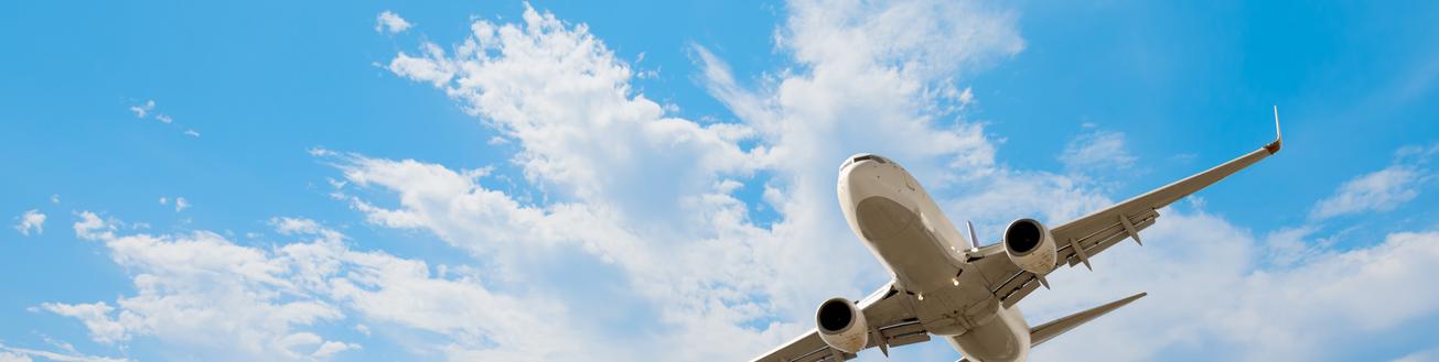 A plane flying across a sky