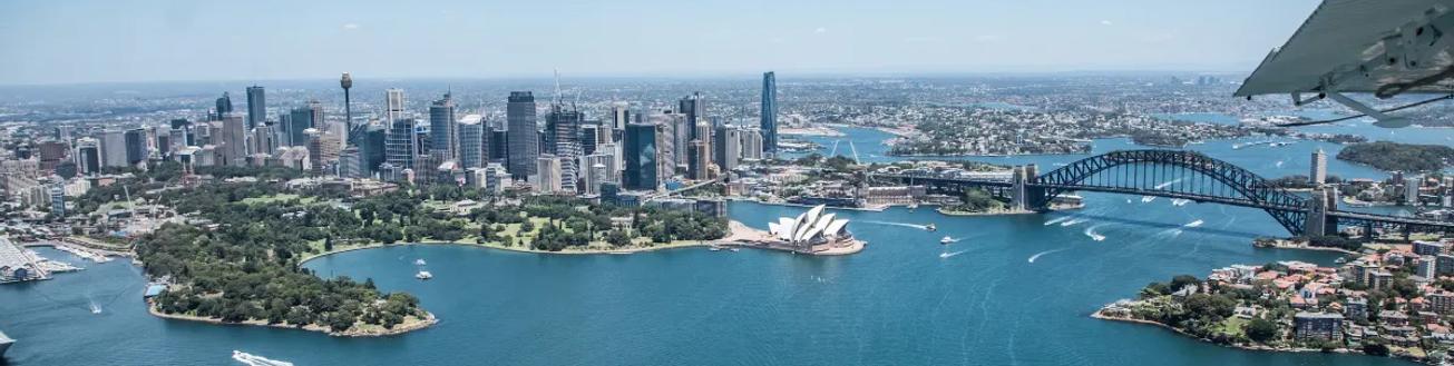 Sydney Harbour, including the Sydney Harbour Bridge and Sydney Opera House from the window of a plane