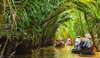 Continuing the journey, get the opportunity to ride a dinghy and explore the breathtaking landscape of a mangrove palm canal. The boat will navigate along the lush green canal bank, passing through rows of nipa palm trees