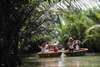 Hop on a traditional bamboo basket boat