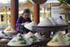 On the way back, stop by the Conical hat village and incense stick village (practical experience with making conical hats and incense sticks at local house).