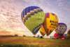 Behold the gigantic hot air balloons inflate before your flight