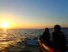 Sunset viewing time while cruising on a canoe