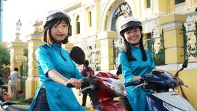 Street Food and Sightseeing Night Tour with Aodai Rider in Saigon