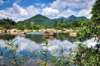 Continue to Ham Ho Eco-tourism Area - Take a boat ride on Loc Giang canal to Kut river with the Sky River filled up like a miniature "Ha Long Bay", blending with unspoiled nature, young plants and water.