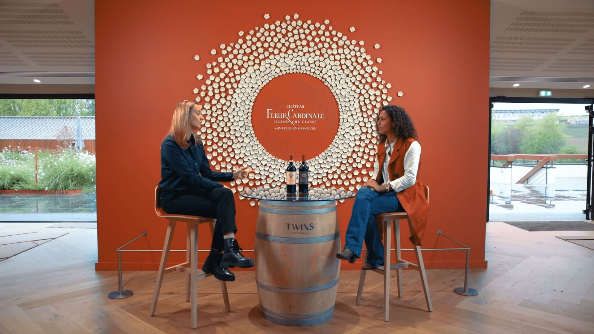 People at barrel table with wine