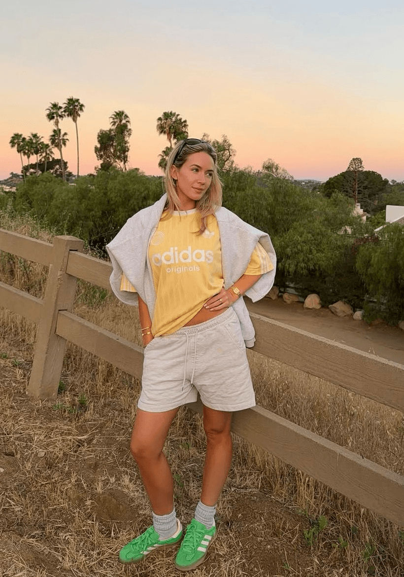 Sophia Tuxford wearing an adidas yellow Originals Football Oversized T-Shirt